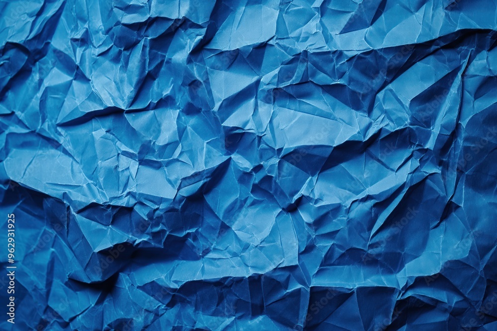 Poster crumpled blue paper texture background with rough uneven surface. close-up view of folded, creased b