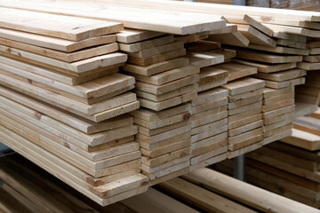 floor boards stack in a warehouse or market, closeup.
