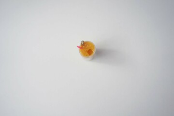 clay miniature on grey background