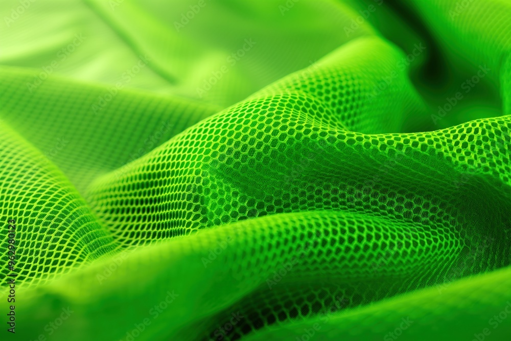 Poster close-up of green fabric with small circular holes, textured surface, synthetic material possibly po