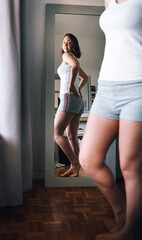 Underwear, buttocks and reflection of body of woman in home for weight loss results, health detox or wellness. Mirror, happy girl and shape for slim figure, diet progress and check glutes in bedroom