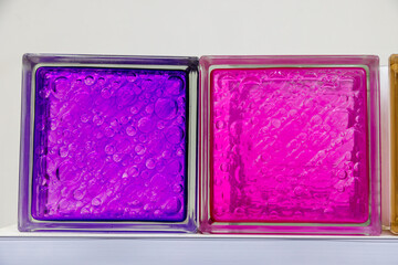 decorative transparent pink and purple glass bricks.