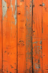 Old weathered wooden planks with orange hue, rough texture and small holes. Close-up view of rustic wood surface, blurred background emphasizes texture and color.