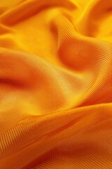 Vibrant orange fabric with criss-cross pattern, close-up view from slightly elevated angle. Fabric texture stands out against blurred background. Suitable for sports clothing and abstract design.