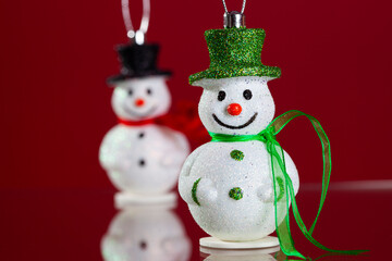 Snowman christmas decoration with red background