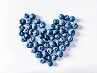 Blueberries  heart on white background