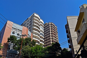 Fototapeta premium Residential building facades and trees in the Tijuca neighborhood, Rio de Janeiro, Brazil