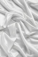 Obraz premium Close-up view of white fabric possibly sheet curtain folded in half revealing intricate texture, patterns. Fabric appears smooth with wrinkles creases.