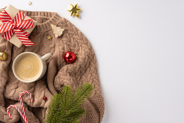 Warm and festive flat lay featuring a knitted sweater, coffee, and Christmas ornaments with candy...