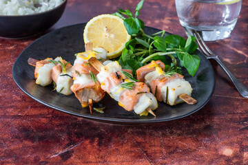 Mini salmon and halibut skewers marinated in honey, rosemary and lemon