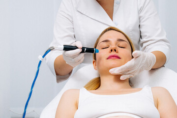 A dermatologist performs a hydro peel facial, highlighting advanced skin therapy for rejuvenation....