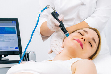 A dermatologist performs a hydro peel facial, highlighting advanced skin therapy for rejuvenation....