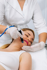 A dermatologist performs a hydro peel facial, highlighting advanced skin therapy for rejuvenation....