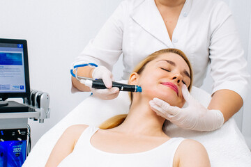 A dermatologist performs a hydro peel facial, highlighting advanced skin therapy for rejuvenation....