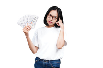 An asian woman holding money while thinking isolated transparent