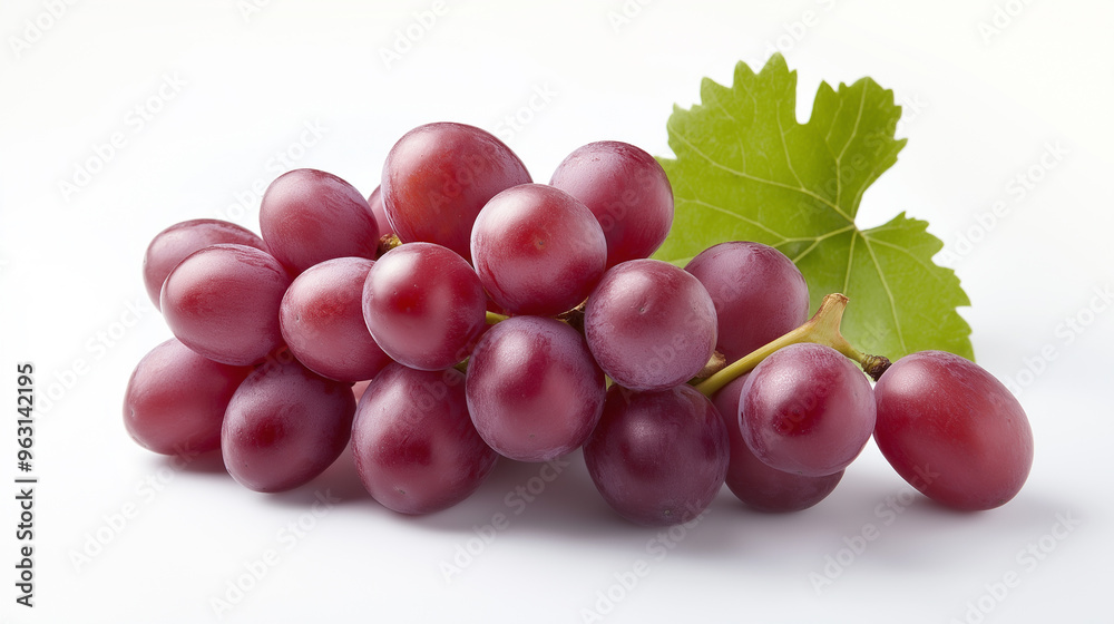 Wall mural fresh, juicy grapes piled together on a bright green leaf.