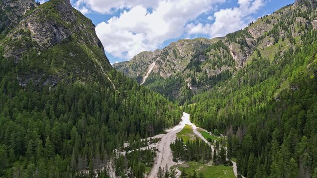 aerial view of the mountain landscape of the Dolomite Alps. Incredibly beautiful nature, rocky mountain ridges covered with forests. High quality 4k footage