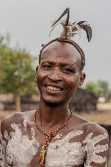 Ethiopia, man from the Karo tribe with typical head decoration and face paintings in his village in...