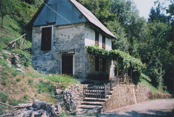 Ancient Mountain House in Valli del Natisone, during a Sunny Summer Day. Udine Province, Friuli Venezia Giulia. Italy-Slovenia Border. Film Photography