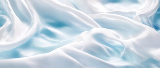 Obraz premium Soft white silk fabric draped elegantly on a light blue background