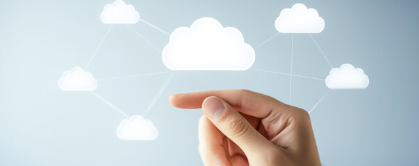 A hand interacting with digital cloud technology, symbolizing connectivity and data management in a modern environment.