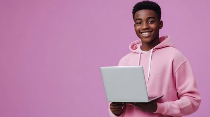 Young happy African American teenager student boy wearing pink hoodie holding laptop using computer technology advertising elearning education and online webinars isolated on light pur : Generative AI