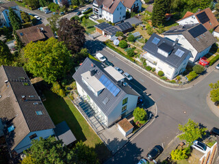 Solar panels on the roof top of private buildings in Germany on a summer day