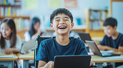 Cheerful wheelchair-bound student using a laptop and enjoying a laugh with classmates in the background