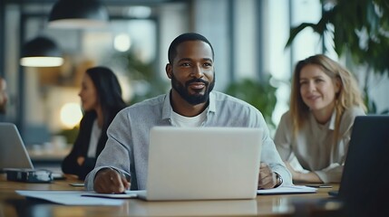 Obraz premium Multiethnic business team working in small office space using laptop computer cooperating on project common tasks talking at shared workplace tables Modern rental coworking space : Generative AI