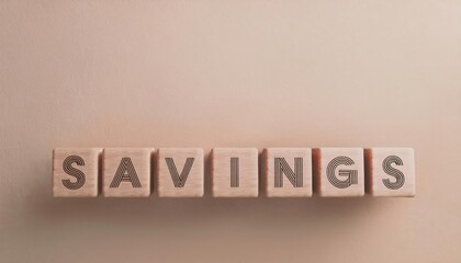 Wooden blocks spelling out savings represent financial growth and planning. Ideal for finance, budgeting, and investment themes.