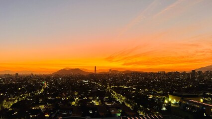 Fototapeta premium sunset in the city of Santiago. sunrise in the city. Beautiful sunset over city. Sunset and city scape in Santiago Chile.
