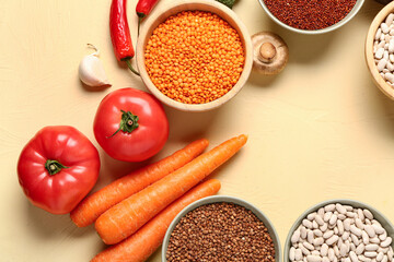 Different fresh vegetables and cereals on yellow background, closeup