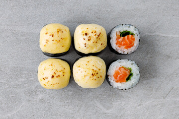 delicious fresh baked sushi roll with crab mayonnaise Philadelphia cheese.
