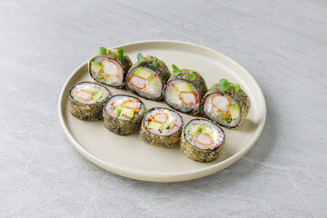 Japanese sushi tempura maki crab meat and tobiko roll on slate. Japanese traditional fusion food...