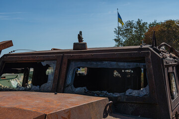 A detailed view of the interior of a war-torn car, with rust and decay taking over every surface....