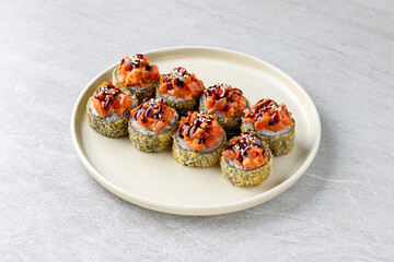 Japanese sushi tempura maki crab meat and tobiko roll on slate. Japanese traditional fusion food style, restaurant menu