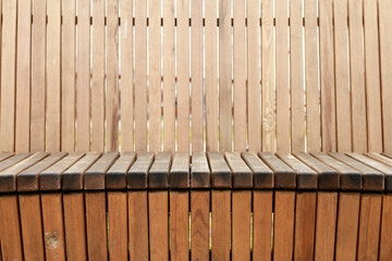 A wooden bench with no one sitting on it