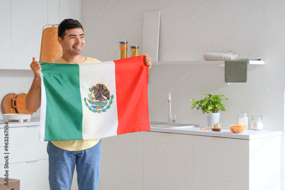 Wall mural Young man with Mexican flag in kitchen