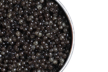 Black sturgeon caviar. Sturgeon caviar isolated on a white background in a jar. Top view