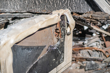 Burning fire in an old broken TV set, toxic air pollution from burning plastics of tube CRT television