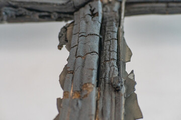 Broken window during a fire caused by military shelling. Broken window of residential home in close-up. Broken glass window outside Dirty broken glass. Russian-Ukrainian war.
