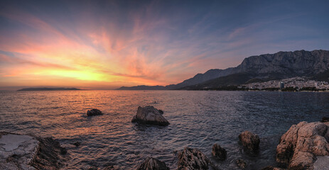 Colorful sunset on Makarska Riviera, popular touristic coastline of the Adriatic Sea in Split-Dalmatia County of Croatia