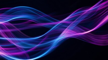 Obraz premium Abstract purple and blue light trails flowing on black background