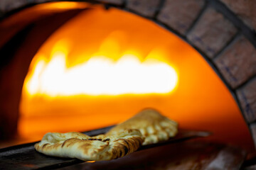 Old style middle east stone oven. Lebanese food Manakish baked in the stone oven 
