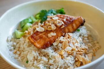 Fried rice with salmon steak served on plate