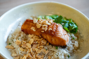 Fried rice with salmon steak served on plate