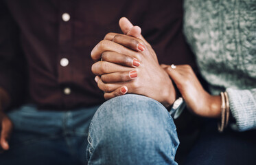 Couple, empathy and bonding with holding hands for assistance, help and grief in home. People, care and support for healthy conversation or compassion with love or connection for marriage counselling