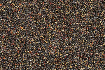 black quinoa as a background. Top view. Flat lay