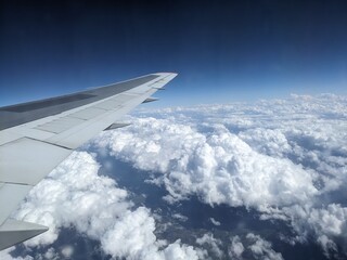 View from the porthole of the mountains and clouds