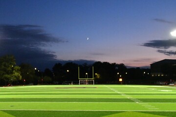 Moon and Clouds Over a Football Field